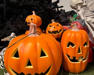 Halloween Decorations -- Pumpkins, Oversized Spiders and Skeletons.