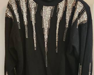 1980's sweaters and other fashions, each with their own set of shoulder pads!