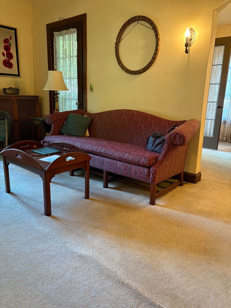 Lovely couch! Ornate round gold frame!