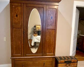 ANTIQUE OAK ARMOIRE WITH BEVELED MIRROR