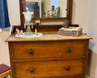ANTIQUE DRESSER WITH MIRROR, VINTAGE LAMP, OLD BOOKS