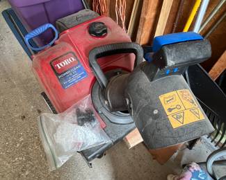 Toro snowblower (handle is behind the purple bins!)