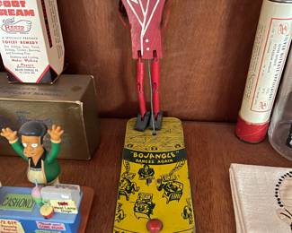 Dancing tin toy