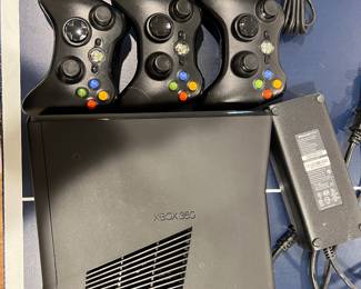 Xbox 360, three controllers, and Xbox camera