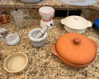 Assorted kitchen items: mortar and pestle, brie baker, tortilla warmer, butter warmer, etc.