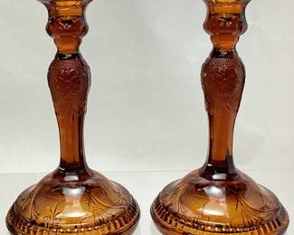 PAIR OF TIARA GLASS AMBER SANDWICH PATTERN CANDLE STANDS