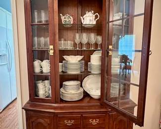 Beautiful solid cherry china cabinet with two sets of fine china to choose from...