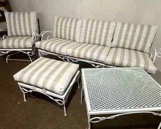 Metal outdoor furniture with well cared for cushions