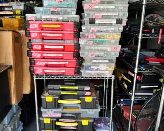 Many multi-compartment cases packed with nuts, bolts, splicers, screw, nails, sprinkler, plumbing, and a/c parts