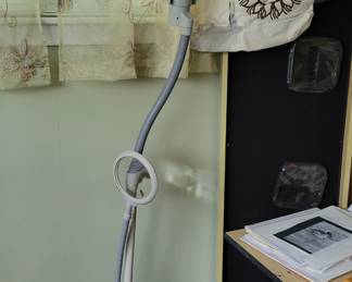 Craft cabinet with drop down table, adjustable lamp
