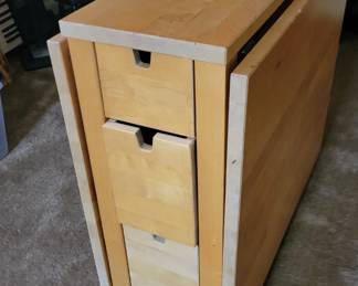 Drop leaf table with drawers