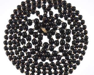 A Set of Three Onyx and Gold Necklaces