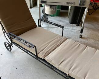 Wrought iron lounge chair with cushion