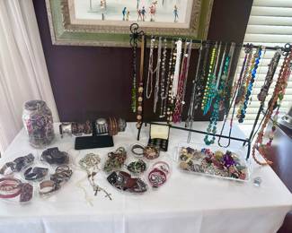 Table full of costume jewelry.