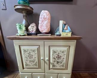 Side cabinet with closed storage.