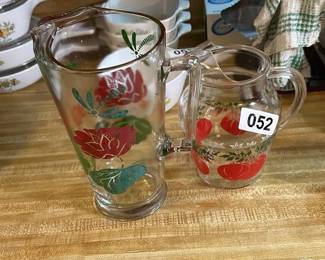 TWO GLASS PITCHERS