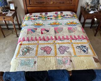 A gorgeous 1880’s Eastlake spoon carved walnut bed — headboard, footboard, and side rails, stained glass table lamps, vintage and antique quilts - including hand made wedding ring quilt, a citrus fruit basket quilt with shades of orange, yellow, blue and green on white ground, a 1930s fan pattern quilt, a lovely vintage butterfly design quilt, and a "Sunbonnet Sue" quilt; and pairs of men's jeans
