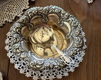 A vintage Gorham sterling silver repoussé chased decorated candy dish / bowl and a silver serving spoon