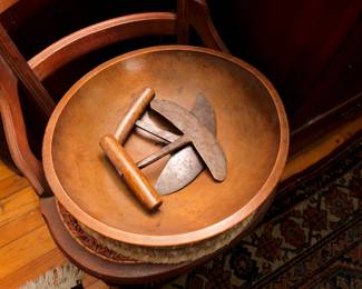 Closeup of the antique hand carved wooden bowl with three antique primitive herb choppers – hand forged iron with wood handles
