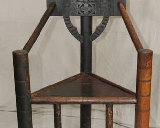 A vintage Swedish Monk Chair, featuring intricate hand-carved detailing that highlights the rich gothic and folk influences in the design.