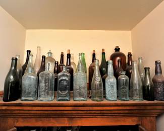 Collection of antique early American glass bottles including such Kalamazoo Bottling Co., and medical curatives as Dr. Kennedy's Medical Discovery, Roxbury Massachusetts; Dr. Kilmers Swamp Root Kidney Liver & Bladder Cure