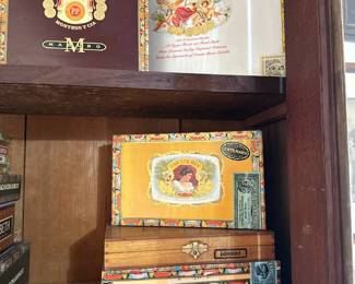 Another view of a connoisseur's collection of vintage and antique cigar boxes with – including Romeo & Julieta, Punch Cigars, Don Diego, Juan Lopez, H. Upmann, Macanudo, Macbeth Banquo, Don Tomás, Arturo Fuente, Cuesta-Rey and more. Beautiful old world typography and colorful illustrations!