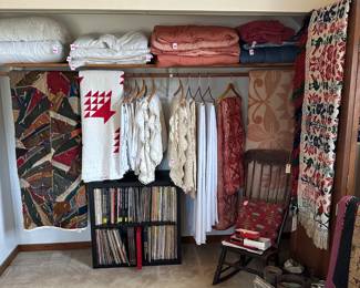 Bedding including pillows, wool blankets, hand crocheted bedspreads, vintage and antique quilts and woven coverlets — a vintage/antique handmade multi-colored "crazy quilt" coverlet, a red and white basket patterned quilt, various blankets and comforters, and a stunning American antique 1841 jacquard double weave figured and fancy fringed coverlet by J. J. Heilbronn in Basil, Ohio. Corner signature reads "Katharine Stock Berger Fancy Coverlets Wove by J. J. Heilbronn, Basil Ohio 1841"; men's ties, vintage chairs, vintage vinyl lp record albums
