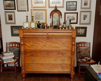 Framed antique photographs, 19th century American chest of drawers with turned legs and columns, pair of beautiful ladder back chairs with cane seats, sets of antique brass sleigh bells, antique William L. Gilbert mantle clock - Jupiter, vintage brass candlestick holders, vintage opalescent swirl glass lampshade, 19th century cast iron fluting pleating iron with hand roller, antique military bugle, vintage Tibetan brass singing bowls, hoof pick, uranium glass vase and flower frog, and more!