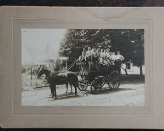 A delightful antique photo of early Saugatuck, Michigan resident Chas. (Charles) Billing with a group riding a horse drawn wagon in the shape of a barrel. No idea what was in the barrel, but the group seems of good cheer! Hand written on the back: "Chas. Billing one of the old timers Saugatuck Mich" and "July 14 1909"