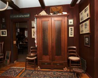 A vintage elegantly tall two-door wardrobe, pair of late 19th century hip hugger ladder back chairs with cane seats, a primitive antique cabbage/slaw vegetable slicer, antique wooden pressed back spindle chair with caned seat