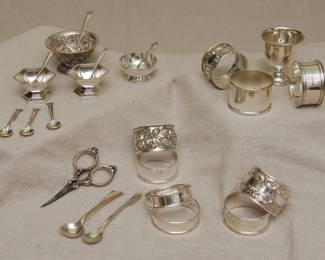 Another view of antique sterling silver napkin rings, sterling silver open salts with spoons (including an Art Deco pair from Webster Company of Attleboro, MA, early 1900's), silver demitasse and salt spoons, a set of three matching sterling silver salt spoons, a late 19th century antique sterling silver embroidery or sewing scissors