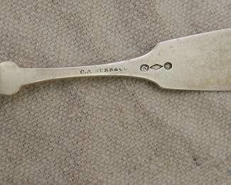 Closeup of the back of one of the C. A. Burr Antique American Civil War era sterling silver spoons; monogrammed, hallmarked. C. A. Burr & Co was a silversmith company active in Rochester, New York, from 1857 to 1863. 