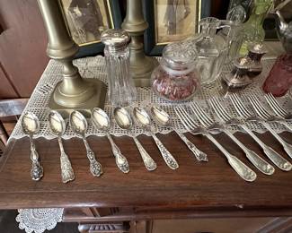 Sterling silver spoons and forks, a glass sugar shaker with pierced silver lid, pair of silver plated salt and pepper shakers, vintage glass cruets 