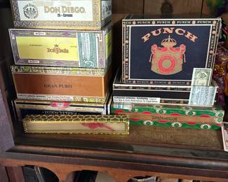 Another view of a connoisseur's collection of vintage and antique cigar boxes with – including Romeo & Julieta, Punch Cigars, Don Diego, Juan Lopez, H. Upmann, Macanudo, Macbeth Banquo, Don Tomás, Arturo Fuente, Cuesta-Rey and more. Beautiful old world typography and colorful illustrations!