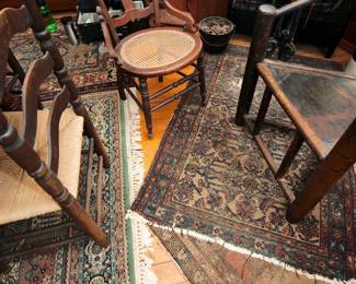 Another view of vintage oriental rugs at this sale — floor runners, area rugs, and more