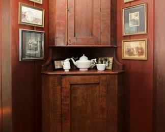 Vintage hand made two-part wooden corner cupboard with textured stain finish