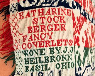Closeup of corner of the stunning American antique (dated 1841) jacquard double weave figured and fancy fringed coverlet by J. J. Heilbronn in Basil, Ohio. Corner signature reads "Katharine Stock Berger Fancy Coverlets Wove by J. J. Heilbronn, Basil Ohio 1841". A fragment of a similar coverlet woven by J.J. Heilbronn is in the Smithsonian museum.  John Jacob Heilbronn, was born June 15, 1815 in Alsace, France. He married January 9, 1840, Phebe Weaver in Fairfield, OH. He died July 8, 1887.