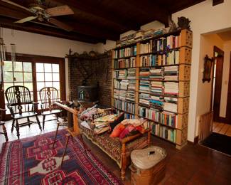 Three 19th Century high back broad arm Windsor chairs, area rug, primitive wood and metal fruit press, lots and lots of great books