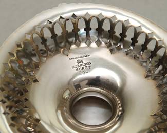 Closeup of markings to the base of the antique American sterling silver footed bowl or compote by Hyman, Berg & Co. of Chicago, Illinois, circa late 19th century.