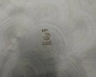 Closeup of hallmarks on beautiful sterling silver cocktail tray, hallmarked 0.925 sterling Mexico