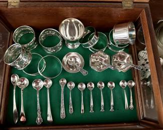 Sterling silver napkin rings; antique sterling silver open salt cellars with spoons (including an Art Deco pair from Webster Company of Attleboro, MA), silver demitasse and salt spoons 