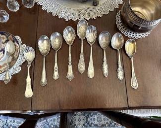 Beautifully crafted sterling silver sugar spoons, including a Reed & Barton 'Francis' sterling silver sugar spoon; many of the spoons are "shell form" 