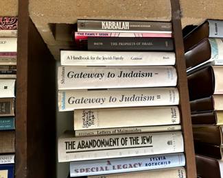 Two shelves of books on Judaism