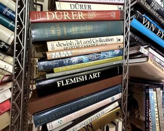 Books including The Grammar of Ornament by Owen Jones, The Anglo-Saxon Chronicles, and History of the English House