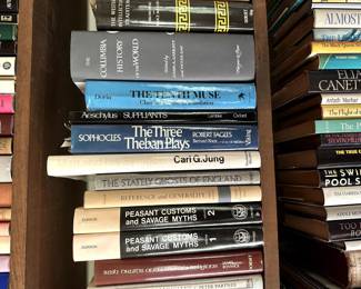 Books including The Stately Ghosts of England by Diana Norman, Plays by Sophocles, and peasant customs and savage myths.
