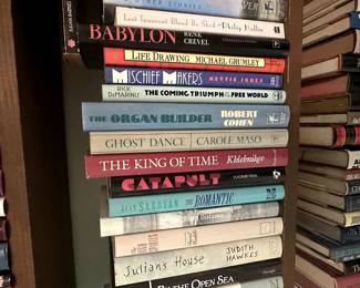 Books including Ghost Dance by Carole Maso, Life Drawing by Michael Grumley, Mischief Makers by Hettie Jones