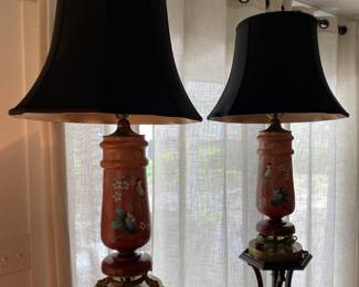 PAIR OF BEAUTIFUL PORCELINE HAND PAINTED LAMP WITH GRIFFEN/DOLPHINE BRASS FEET, BLACK SHADE WITH GOLD INSET