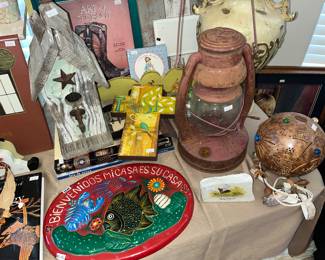 Rustic birdhouse, Mexican Welcome platter & old oil lantern.