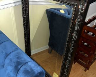 Heavy ornate framed mirror