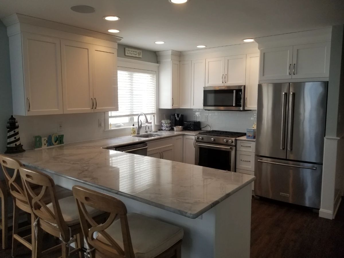 Owner's side kitchen features clean & contemporary updated cabinetry and appliances